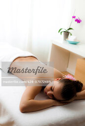 thumbnail of 628-07072489em-teenage-girl-lying-on-massage-table-stock-photo.jpg