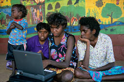 thumbnail of aboriginal-girls-using-a-computer-outside-the-community-centre-at-picture-id531112178-1039195632.jpg