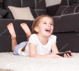 thumbnail of depositphotos_28436703-stock-photo-little-girl-watching-tv-297093602.jpg