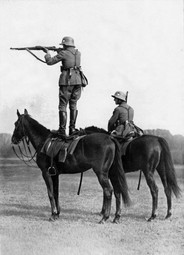 thumbnail of German soldiers take aim from the backs of horses, mid-1930 1.jpg