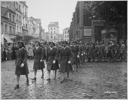 thumbnail of Members_of_the_6888th_Central_Postal_Directory_Battalion_take_part_in_a_parade_ceremony_in_honor_of_Joan_d'Arc_at_the_marketplace_where_she_was_burned_at_the_stake.jpg