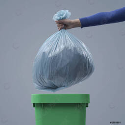 thumbnail of woman-putting-huge-garbage-bag-5103801.jpg