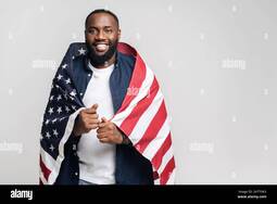 thumbnail of cheerful-black-man-with-american-flag-on-shoulders-over-gray-background-happy-proud-african-man-with-usa-symbol-looking-at-the-camera-patriot-national-event-celebration-independence-day-2H7TGK3.jpg