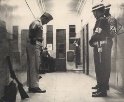 thumbnail of policeman surrenders to the Air Force.jpg