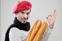 thumbnail of Moustached man holding large breadstick.jpg