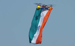 thumbnail of drone-with-flag.jpg