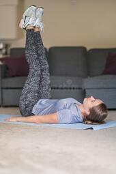 thumbnail of fit-girl-sportswear-lying-floor-doing-yoga-pose-legs-up-yoga-home-sport-health-yoga-concept-gray-sofa-fit-196184411.jpg
