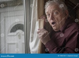thumbnail of Shocked Senior Man Looking Out of Window from Behind Curtains Stock Image - Image of retired ....jpg