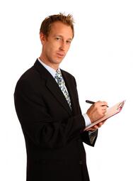 thumbnail of a-young-businessman-holding-a-clipboard-and-pen[1].jpg