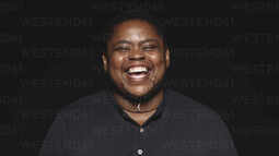 thumbnail of african-transgender-man-laughing-with-eyes-closed-isolated-on-black-background-portrait-of-a-laughing-african-man-JLPSF13637.jpg