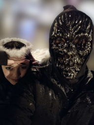 thumbnail of Joel wearing his signature mask.png