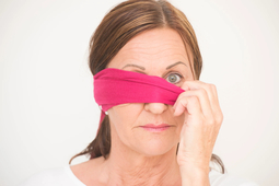 thumbnail of mature-woman-removing-blindfold.jpg