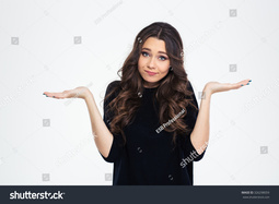 thumbnail of stock-photo-portrait-of-a-pretty-woman-shrugging-shoulders-isolated-on-a-white-background-326298059.jpg