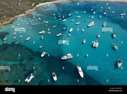 thumbnail of view-from-above-stunning-aerial-view-of-a-beautiful-bay-full-of-boats-and-luxury-yachts-a-turquoise-sea-bathes-the-green-and-rocky-coasts-W8PFW1.jpg